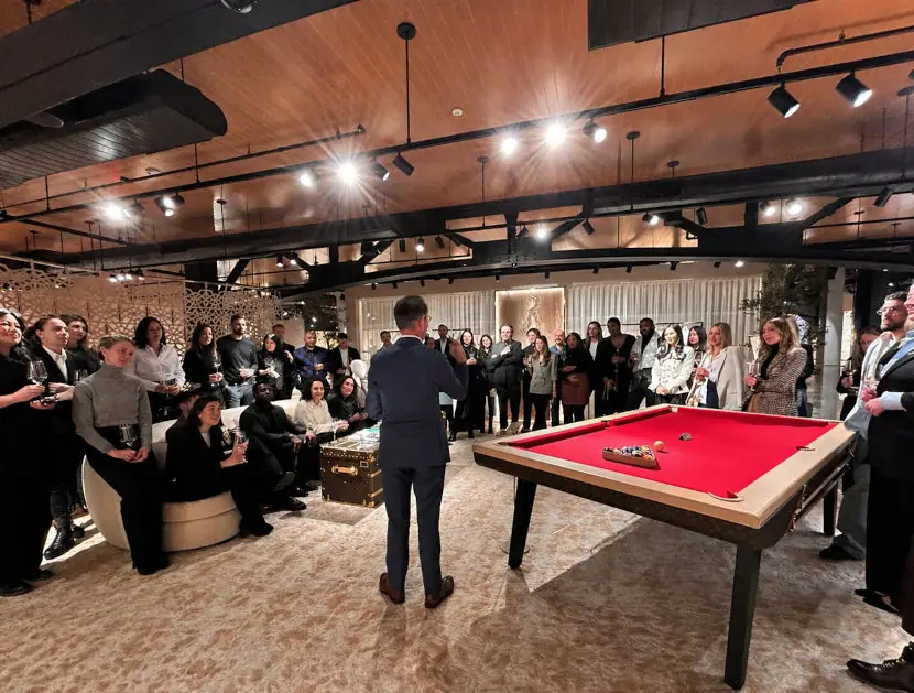Magician performing for a large audience at a corporate event