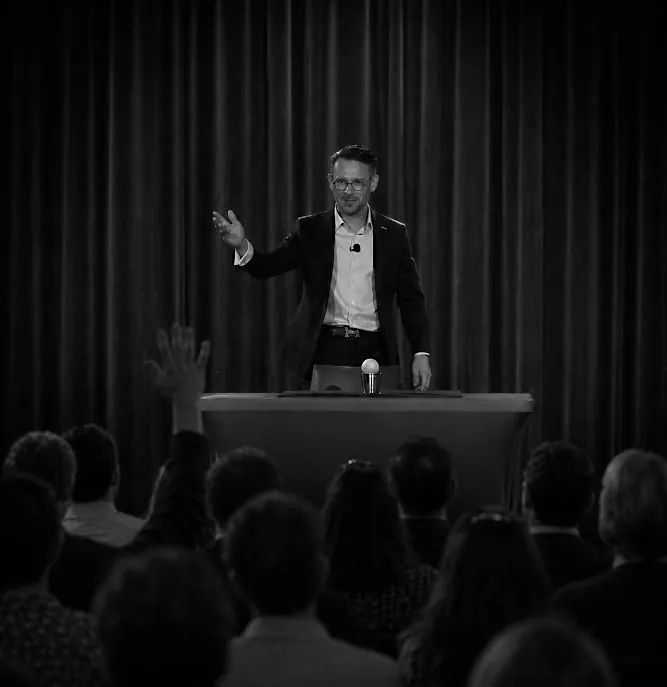 Magician performing an interactive stage magic show in front of an audience
