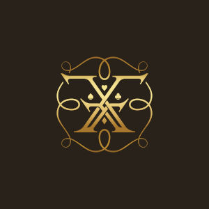 François-Xavier Elegant Magic Artistry gold monogram on a dark background